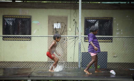 Two indigenous kids at play in their community