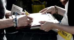 Activists signing a petition