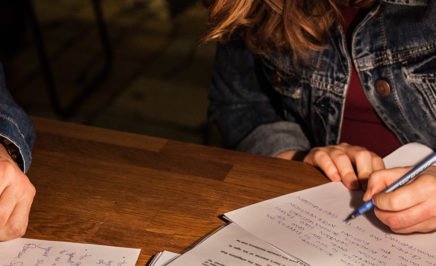 Two activists writing letters