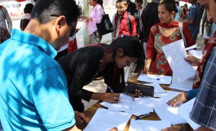 Activists writing letters for Pholachi Rakchongcharoen, a disappeared human rights activist in Thailand