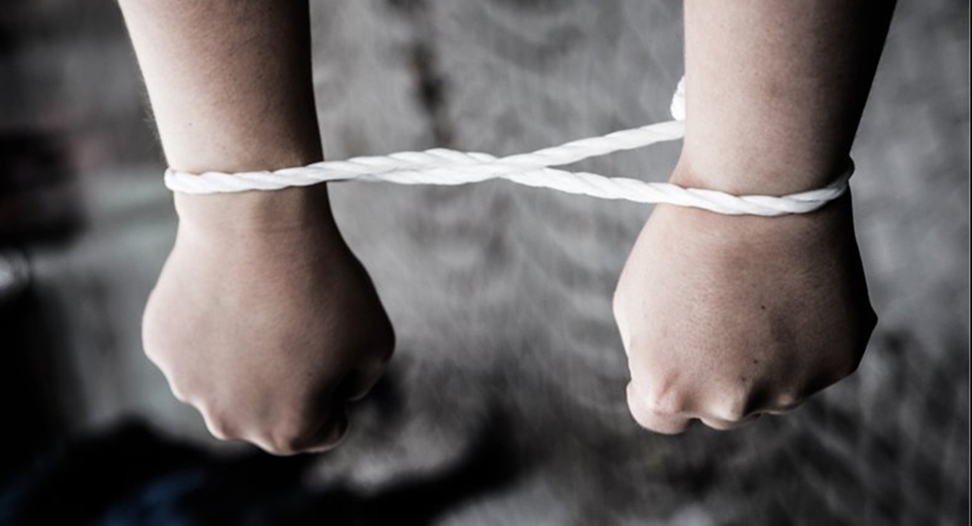 Hands bound at a protest against torture in Uzbekistan
