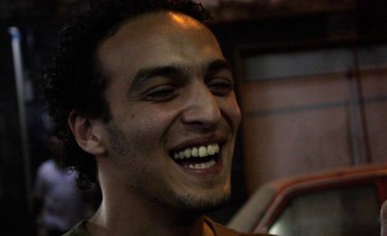 Mahmoud Abou Zeid, also known as Shawkan, laughs at the camera.