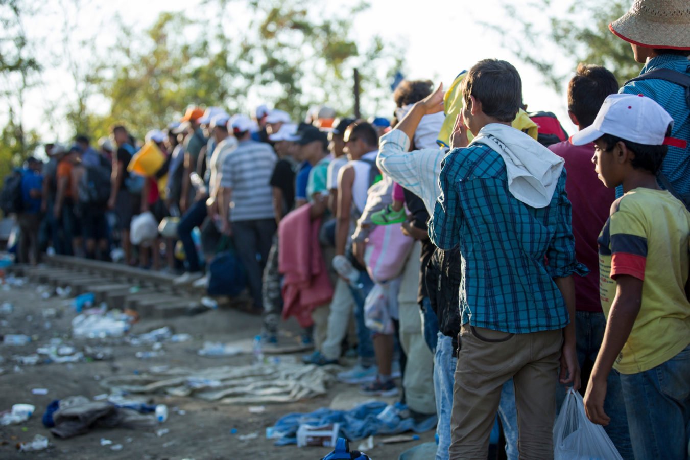 Asylum seekers wait at the Macedonia border near the village of Idomeni, Greece, 24 August 2015