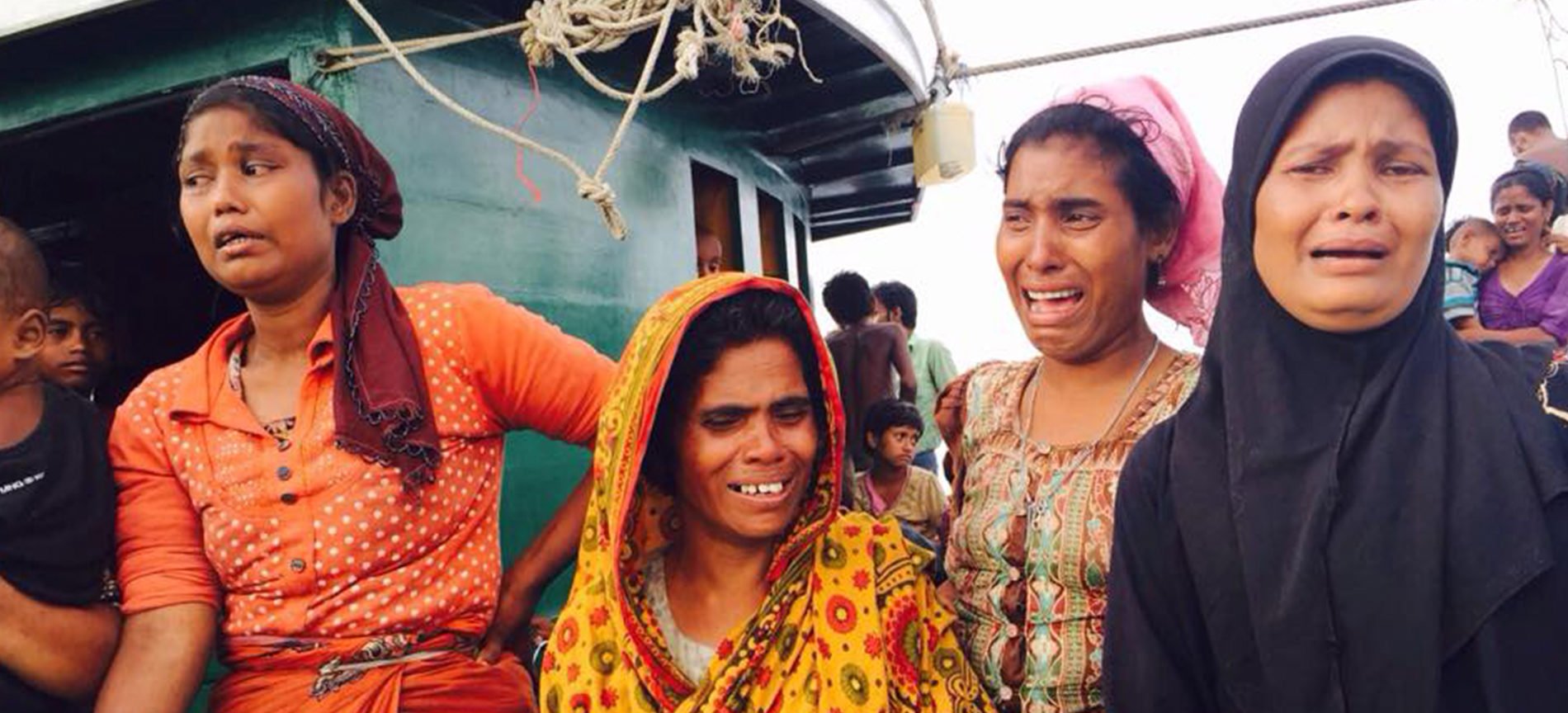 Four distressed women on a stranded boat