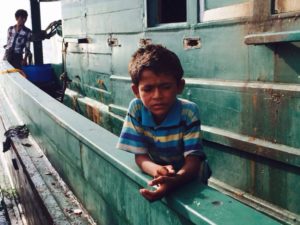 Rohingya child on boat at sea