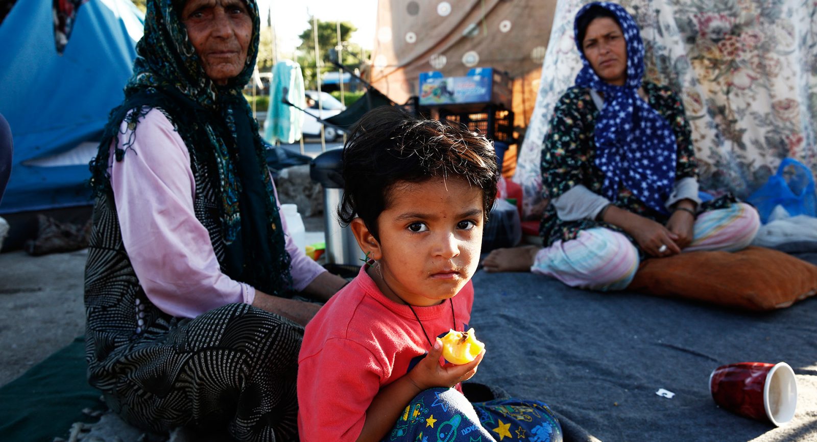 A young Afghan boy and his family who have been living in the old airport of Elliniko, Athens for five months