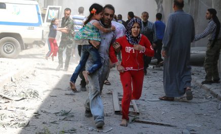 A family run through rubble in Syria searching for safety