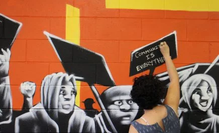 Activist Camille Furtado writing 
