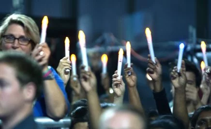 Activists and members of the public hold candles at various #KeepHopeAlive rallies in 2015