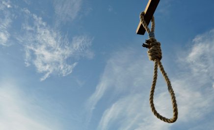 A hangman's noose against a blue sky