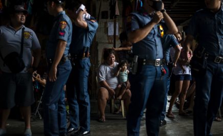 Group of police officers in uniform in front of a camera