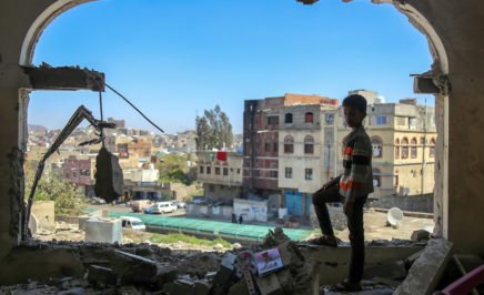 A Yemeni boy checks the damage following a mortar shell attack on the country's flashpoint southern city of Taez.