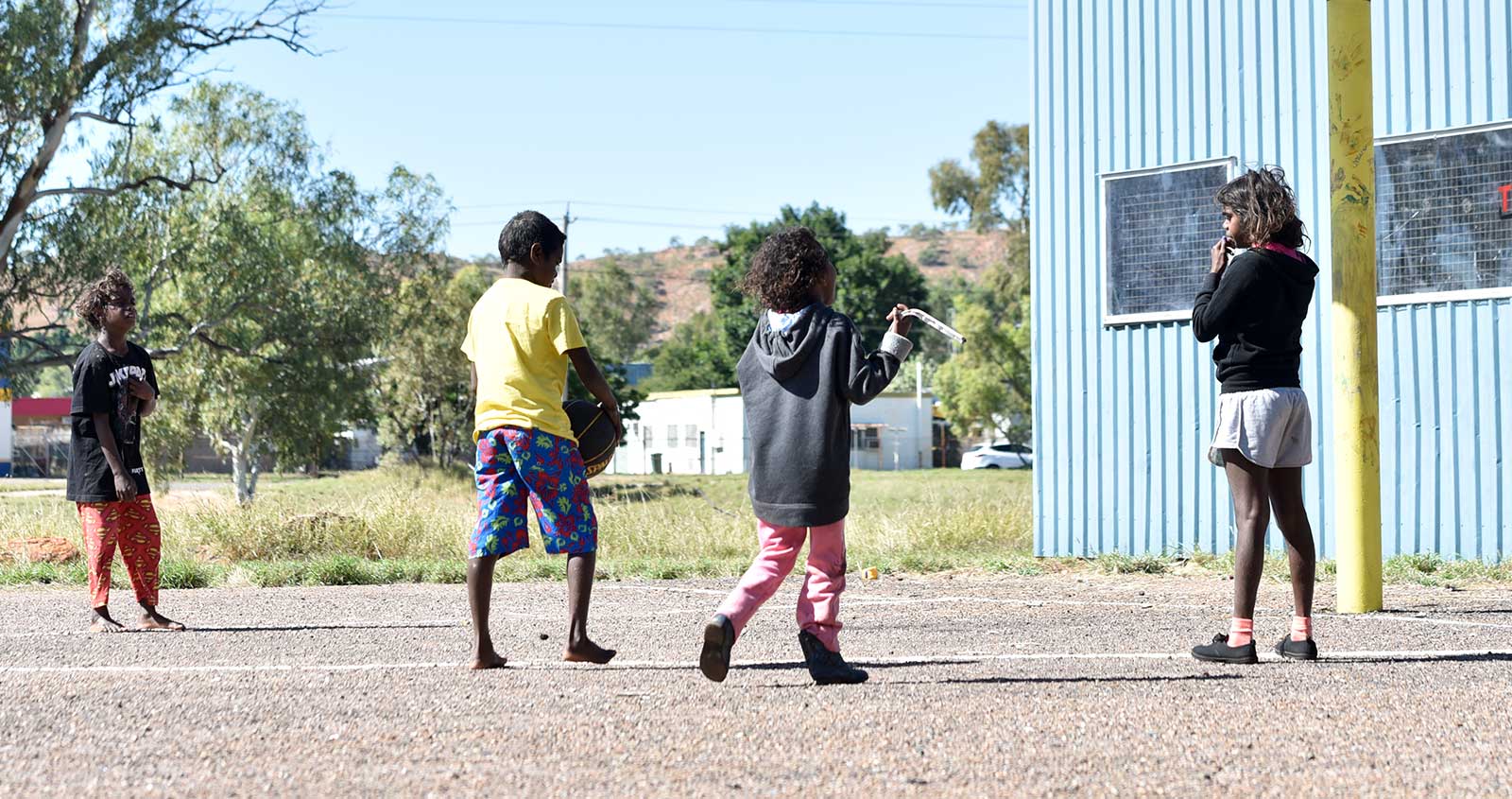 A group of Indigenous children walking together