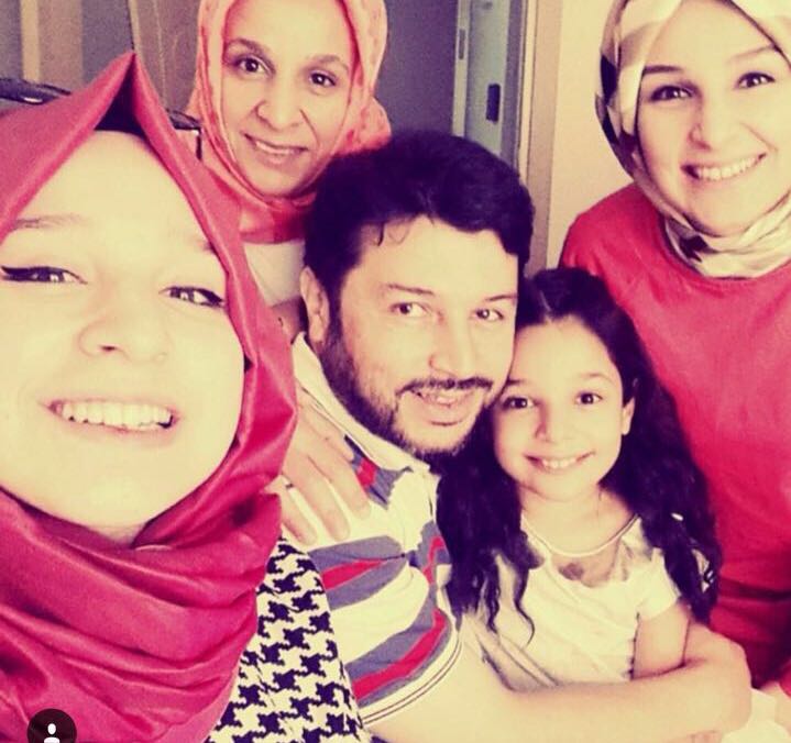 Taner Kilic, the Chair of Amnesty International Turkey, with his daughters and wife.