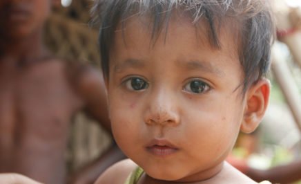 Rohingya baby girl looking into the camera