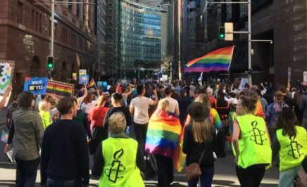 Marriage equality supporters march through the streets of Sydney. © AI