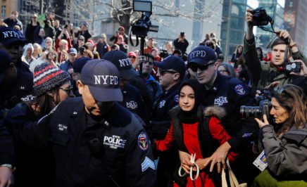 NYPD officers arrest a woman who was taking part in a 'Day Without a Woman' march. © Lucas Jackson/REUTERS