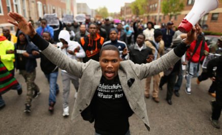 Hundreds of protestors march towards Baltimore western district station over death of Freddie Gray