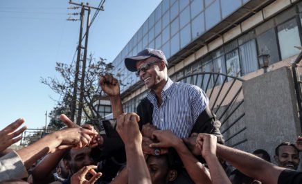 Ethiopian jounalist Eskinder Nega reacts with people after being released from Kaliti Prison in Addis Ababa on 14 February 14 2018.