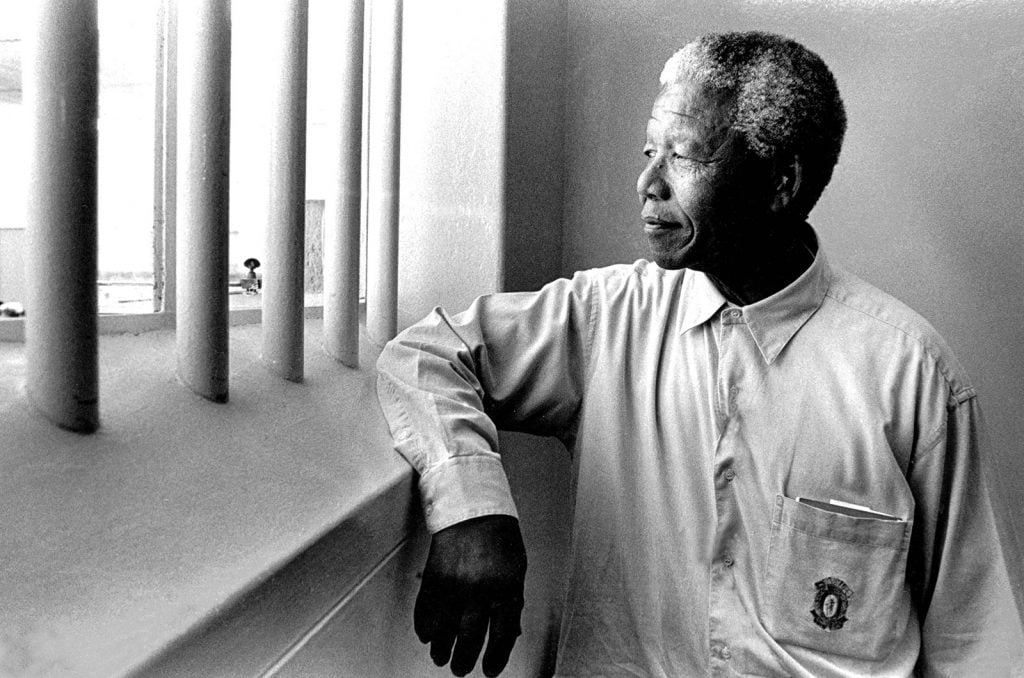 Nelson Mandela revisits his prison cell on Robben Island, where he spent eighteen of his twenty-seven years in prison, South Africa, 1994.
