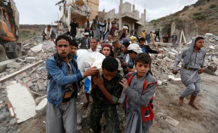 The body of a victim of an airstrike in Yemen is carried out of the rubble