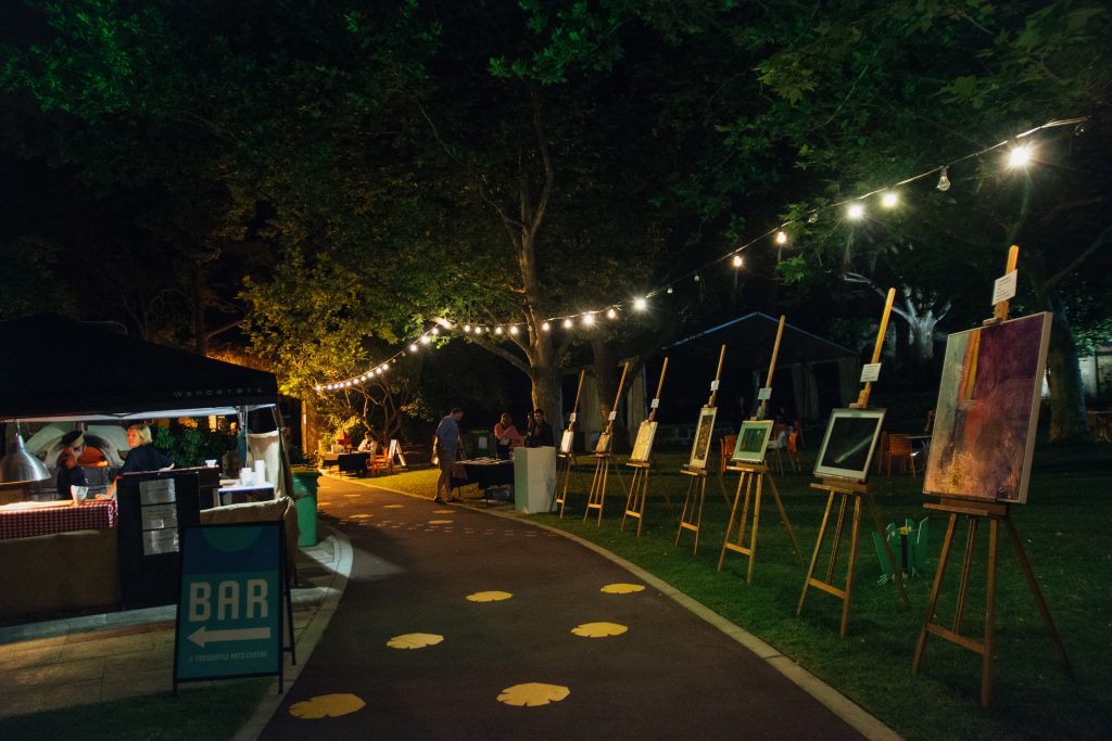 8 art works on isles lined up on walkway in the courtyard of the Fremantle Arts Centre