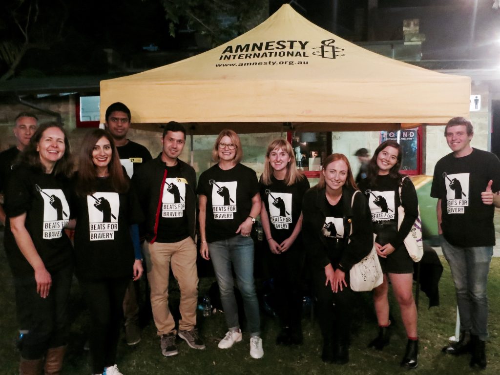 Beats for Bravery volunteers standing in front of the Amnesty tent 