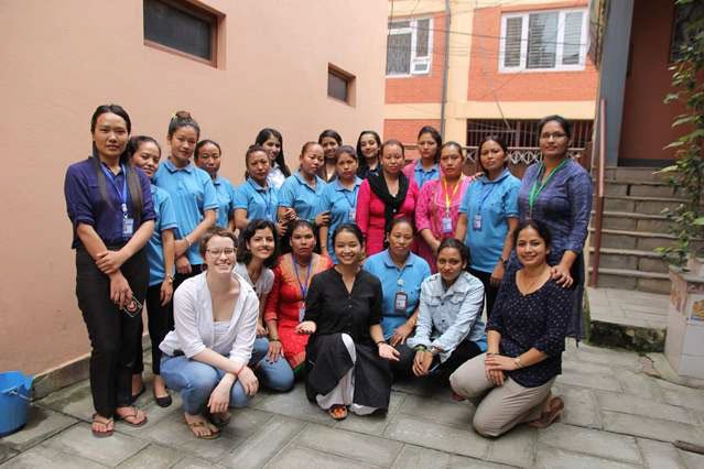 A group of women activists in Nepal smile for the camera.