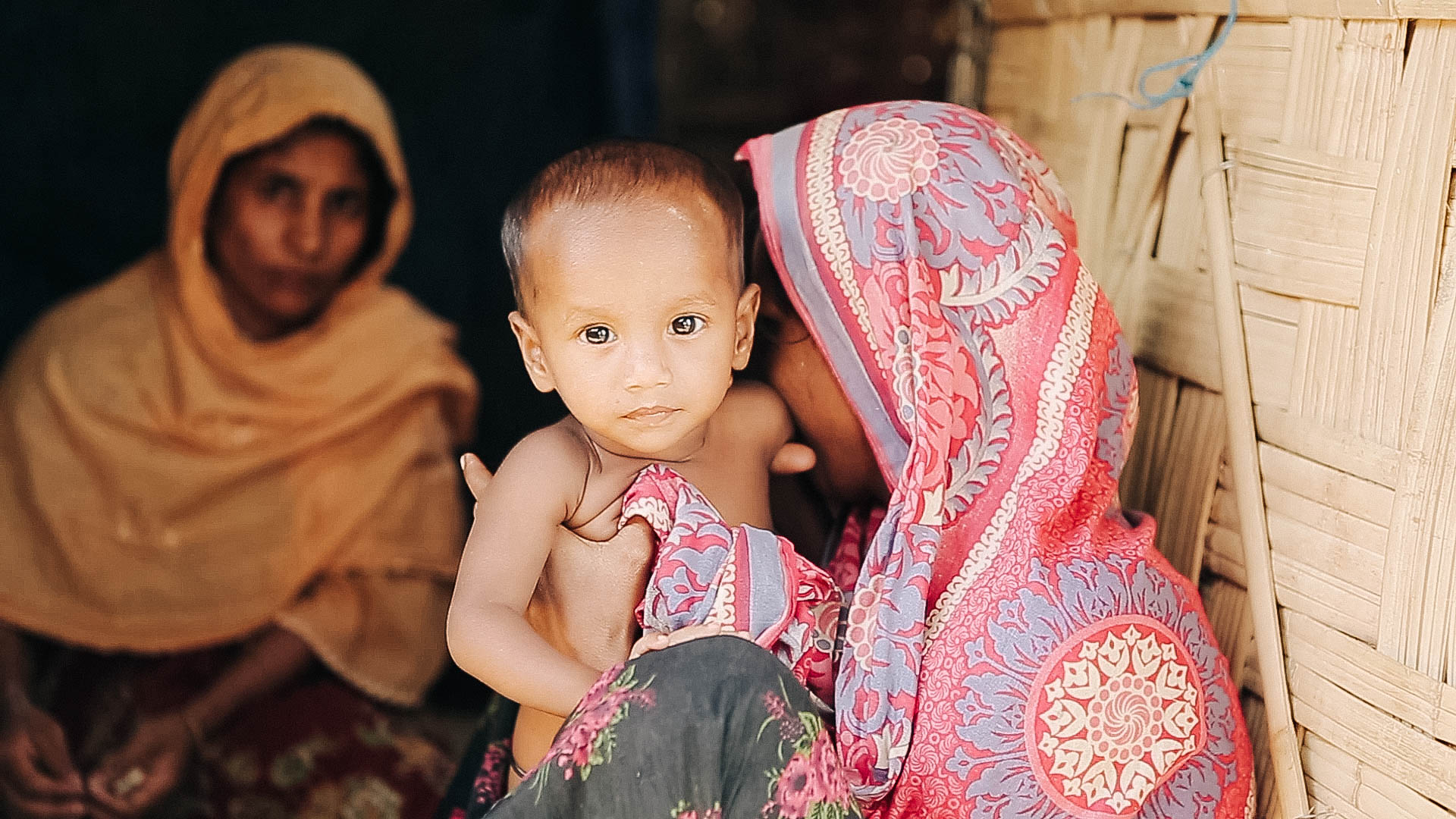 Rohingya child and his mother in a refugee camp
