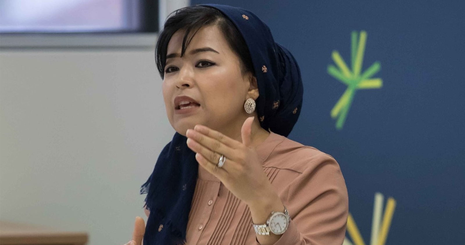 Najeeba Wazefadost speaking at a conference. She is a member of Amnesty's Refugee Advisory Group