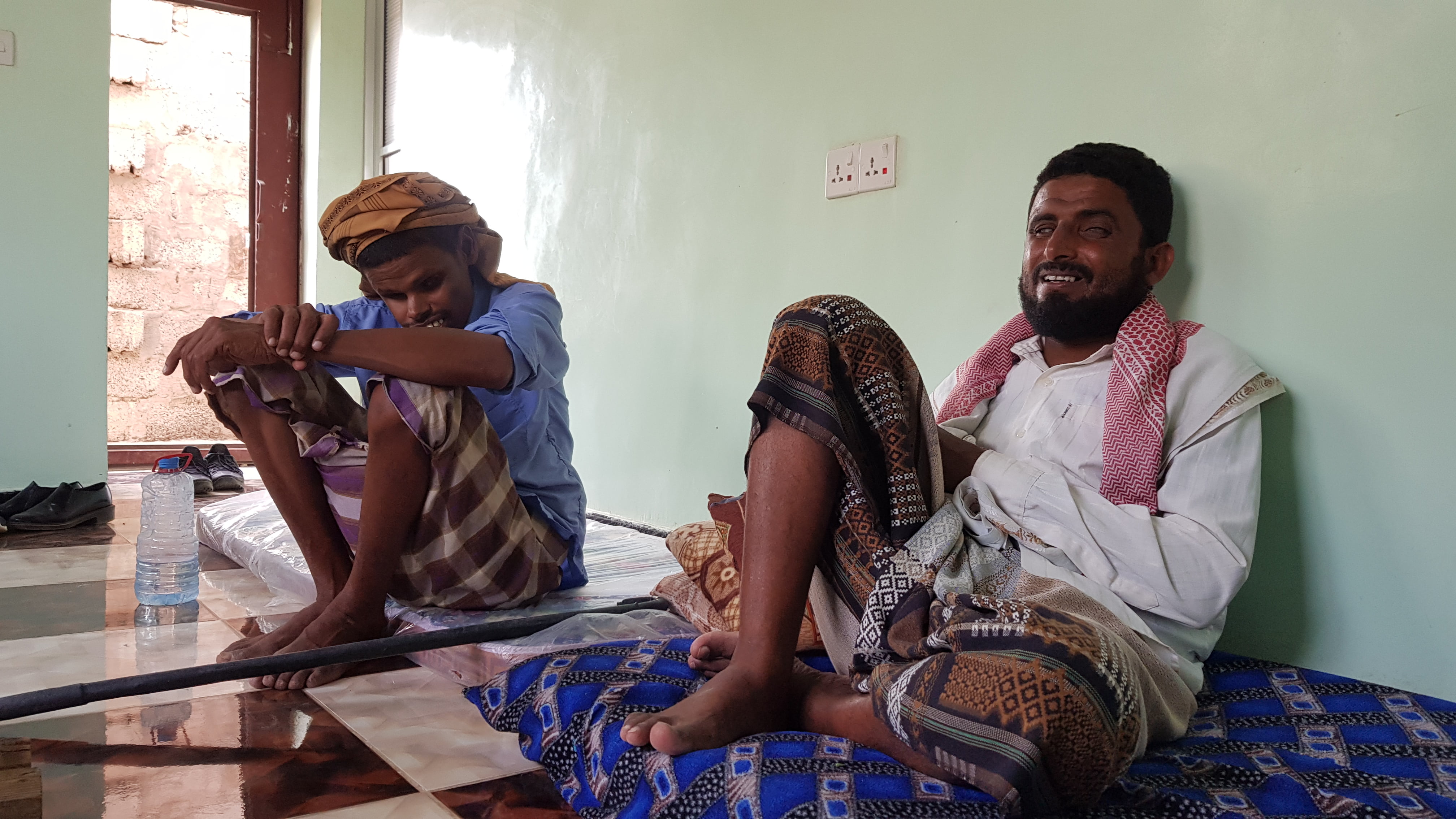 Mohamed Mater Ali and Sale Abdullah sitting down in front of the camera talking to Amnesty International