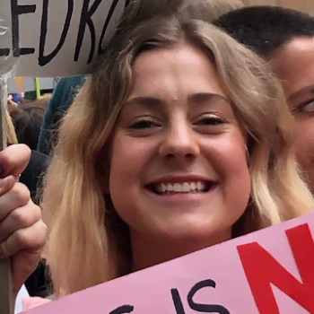 Isabella Neal-Shae smiling at the camera during a protests