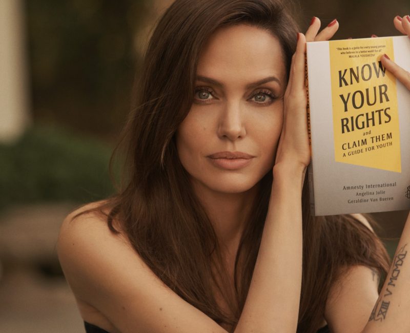 Angelina Jolie with the book 'Know Your Rights and Claim Them'