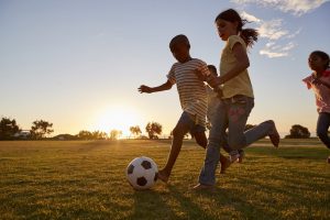 Kids chasing ball