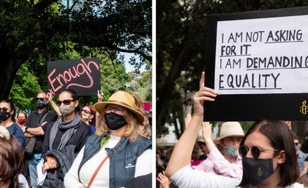 Group of young women activists in Melbourne CBD walking together during a March4Justice protest. One protester holds up a sign saying 