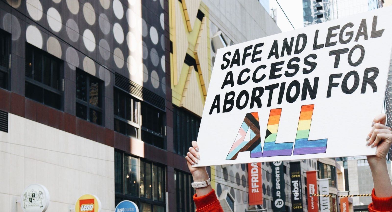 A protester holds a sign that reads 