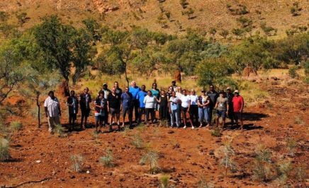 A wide shot of people standing on country, from the Olabud Doogethu Project in the Kimberley.